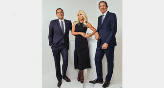 From left to right, Gianni Versace S.p.A CEO Jonathan Akeroyd, design director Donatella Versace and Michael Kors Holdings Ltd. Chairman and CEO John D. Idol. Michael Kors announced Tuesday it was buying the Italian fashion house in a $2 billion deal. (Photo credit: Rahi Rezvani) 20180926_Versace-header.jpg