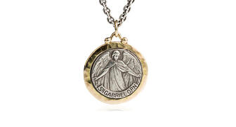 The Brother Wolf pendant depicting St. Gabriel, the Archangel, in sterling silver with 14-karat yellow gold ($700 retail). The virtue assigned to St. Gabriel is strength, as his name means “God is my strength.” Gabriel is considered to be the patron saint of those who work in communication. 20170914_Wolf-Gabriel.jpg