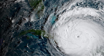 A September 2017 satellite view of Hurricane Irma, which reached maximum sustained winds of 185 miles per hour at its peak. Jewelers Mutual suggests retailers install impact-resistant window systems to protect against strong winds. (Image credit: NOAA) 20190620_Hurricane_Irma.jpg