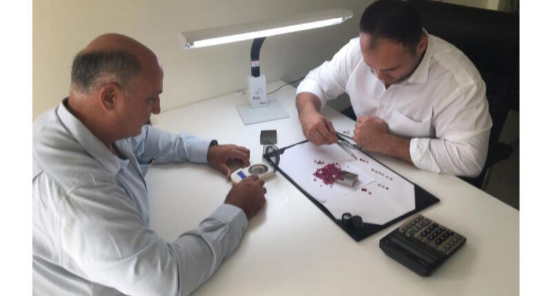 Mustang Resources is moving its sales operations from Mauritius to Chanthaburi, Thailand. In this photo, rubies are being re-sorted for sale at the new facility. 20180312_Mustang-office.jpg