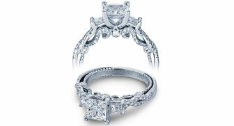 A ring from Verragio’s Insignia collection with princess and round brilliant-cut diamonds surrounding a setting for a princess-cut center. The three-pronged crown-like symbol under the center stone is called the Verragio Crest, a company trademark that’s currently being defended in a number of lawsuits. 20170106_Verragio-ring.jpg