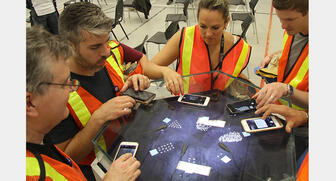 Members of the first Forevermark Carat Club examine rough diamonds during their recent trip to De Beers’ Victor mine in Canada. 20160902_Forevermark-3.jpg