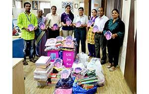 Staff from the GSI and Each One Teach One, a charity in India, stand before the first Joy Box donation, which brought clothes, umbrellas, stationery items and other supplies to underprivileged children in Mumbai. 082114_GSI-Article.jpg