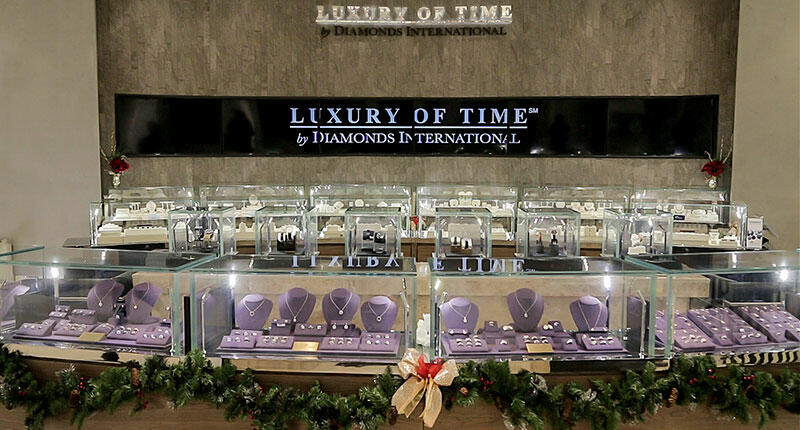 Diamonds International said the interior of its new Disney World store is finished in travertine stone, walnut and chrome. The boutique sells watches as well as jewelry. 20161202_DI-interior.jpg