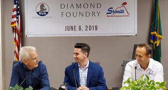 Chelan County P.U.D. General Manager Steve Wright (left), Diamond Foundry Production President Kyle Gazay and Stemilt Growers President West Mathison at the signing for the power supply contract for Diamond Foundry’s second facility last week. 20190612_Diamond_Foundry.jpg