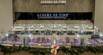 Diamonds International said the interior of its new Disney World store is finished in travertine stone, walnut and chrome. The boutique sells watches as well as jewelry. 20161202_DI-interior.jpg