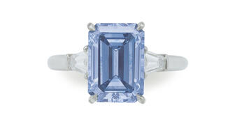 This platinum ring, set with a 3.09-carat rectangular-cut fancy intense blue diamond flanked on either side by a tapered baguette-cut diamond, went for $5.4 million at Christie’s New York on Tuesday. 20180418_Blue-diamond-ring.jpg