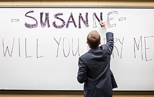 Paparazzi Proposals captured the occasion as Nick Barber popped the question to his girlfriend Susanne Shirey with a Robbins Brothers engagement ring at the University of Texas at Arlington, where the couple met. 061714_Robbins_Paparazzi-Article.jpg