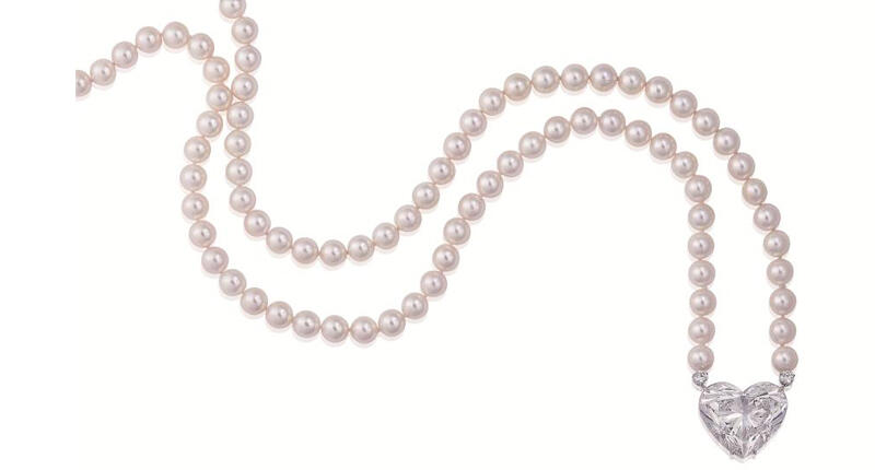 This 92-carat D flawless heart-shaped diamond sold Wednesday at Christie’s jewelry sale in Geneva. Suspended from a stand of cultured pearls by Boehmer et Bassenge, the stone garnered about $15 million, or $163,016 per carat. 20170424_La-Legende-necklace.jpg