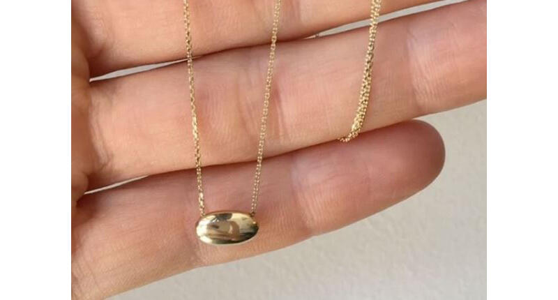 Mociun came up with what she calls a “Time Capsule,” a 14-karat yellow gold hollow bead, which she filled with a tiny amount of the deceased pet’s ashes and mounted as a necklace on a gold chain. 20161201_Mociun.jpg