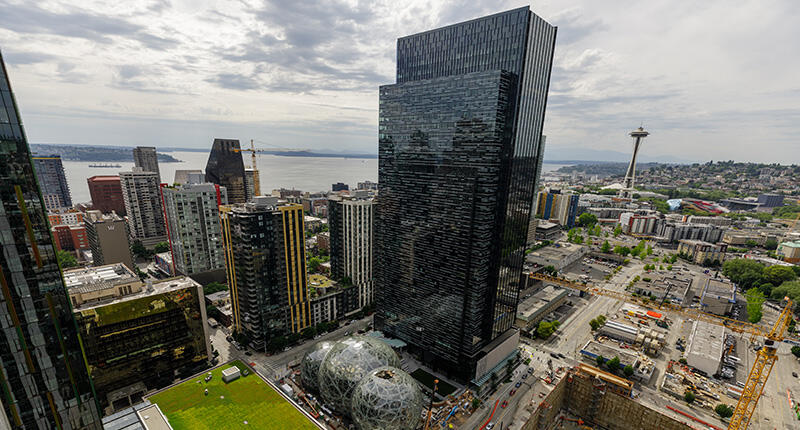 A shot of the Amazon headquarters in downtown Seattle. The online giant, which is said to be laying off hundreds of employees in Seattle and elsewhere, has more than 560,000 employees worldwide. (Photo courtesy of Amazon) 2018_Amazon-HQ-Seattle.jpg