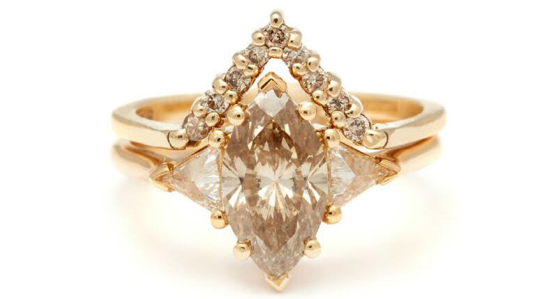 According to a recent survey from Robbins Brothers, shoppers today prefer vintage-inspired rings, followed by fancy cuts. Pictured here is Anna Sheffield’s “Bea Suite No. 24,” featuring a 1.66-carat marquise champagne diamond center and 0.25 total carats of white diamond trillions in 18-karat yellow gold on the ring and 0.17 carats of champagne diamonds in 14-karat yellow gold on the chevron band ($10,600 for the set). 20171127_Anna-Sheffield.jpg
